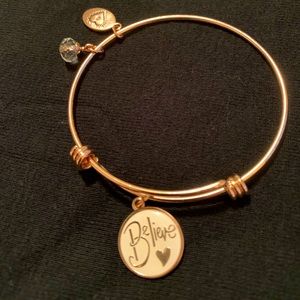 Rose gold bangle bracelet. Footnotes. Believe.